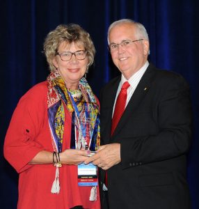 Doris Fleishman receiving an award