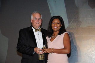 Woman accepting FPRA award of recognition.