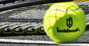 Innisbrook tennis ball and racket close-up