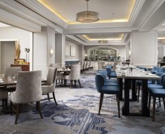 Waldorf Astoria Orlando dining room with blue and white furniture